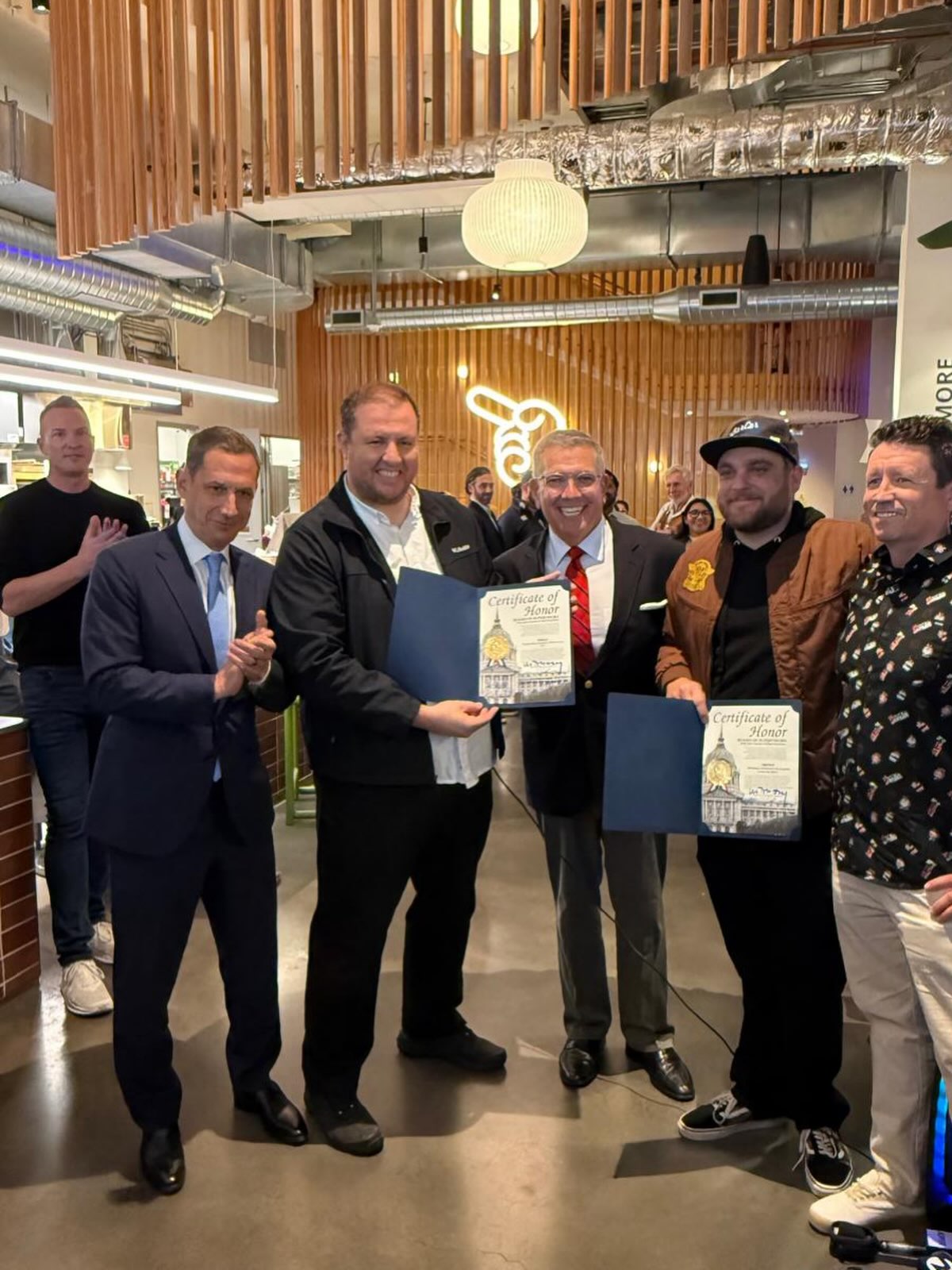 Oklava team receiving a City of Palo Alto certificate of honor
